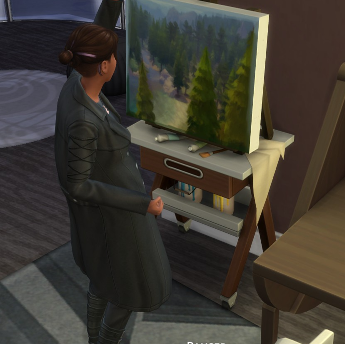 A Sims 4 screenshot, Ajei cheering as she paints a very gorgeous forested landscape.